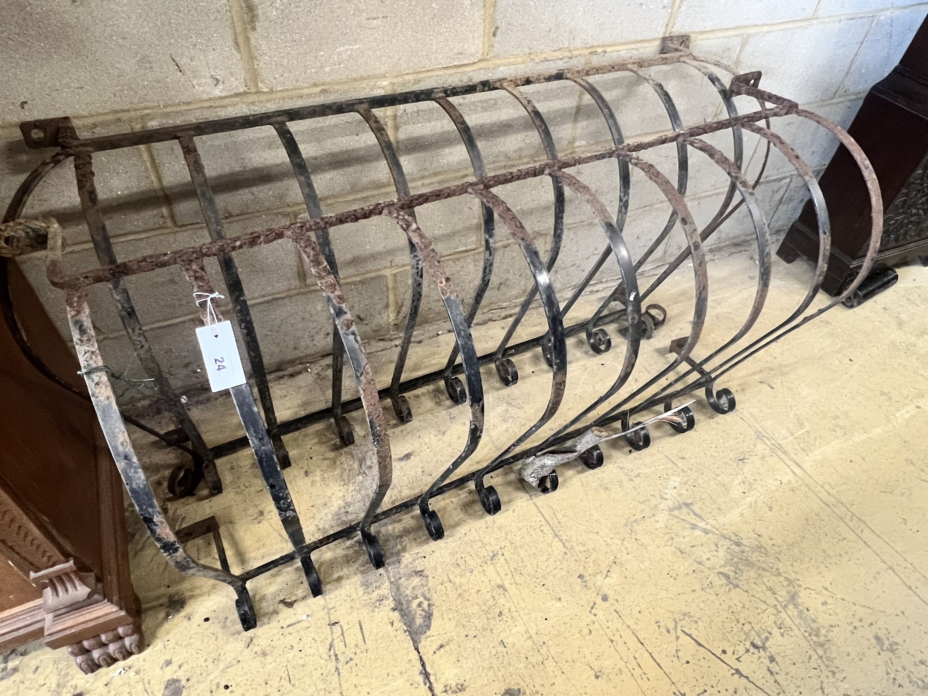 A pair of wrought iron bowfront balcony rails, widest 140cm height 71cm